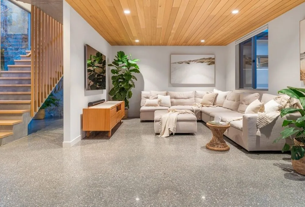 Contemporary seamless polished concrete flooring for an industrial modern farmhouse look in Attappadi, Western Ghats.